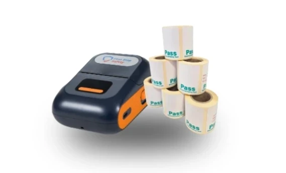 FirstPrint Thermal Printer from First Stop Safety with a stack of PAT labels